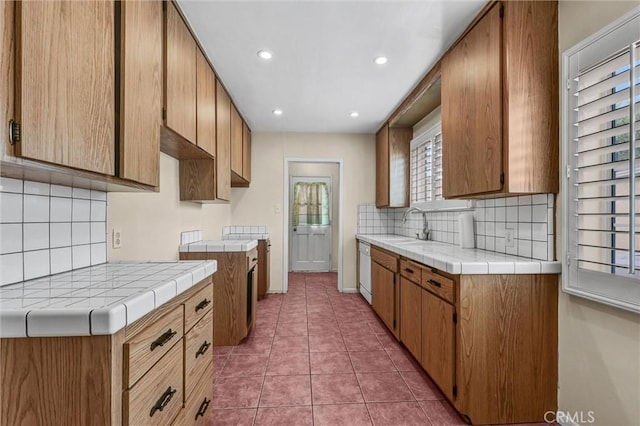 7518 Loch Alene Ave, Pico Rivera, CA 90660 - kitchen with recessed lighting, tasteful backsplash, tile countertops, tile patterned flooring, and dishwasher