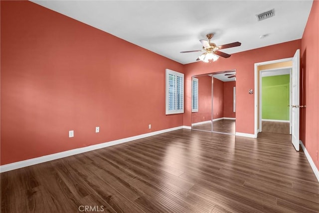 7518 Loch Alene Ave, Pico Rivera, CA 90660 - unfurnished room with dark wood-style floors, visible vents, a ceiling fan, and baseboards