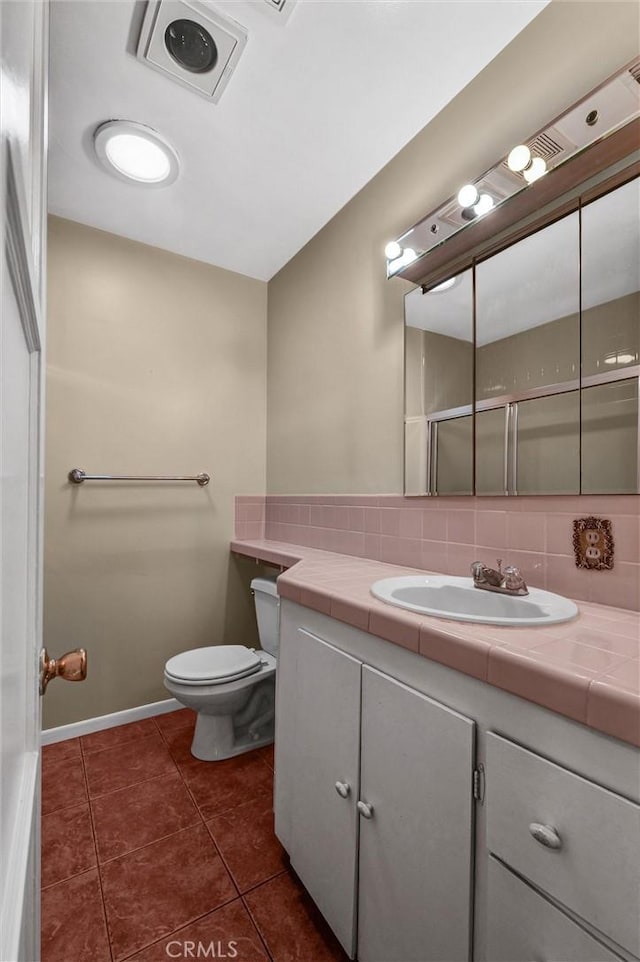 7518 Loch Alene Ave, Pico Rivera, CA 90660 - bathroom with tile patterned flooring, backsplash, toilet, vanity, and visible vents