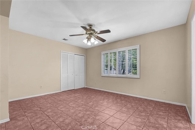 7518 Loch Alene Ave, Pico Rivera, CA 90660 - unfurnished bedroom featuring light tile patterned floors, visible vents, baseboards, a closet, and a ceiling fan