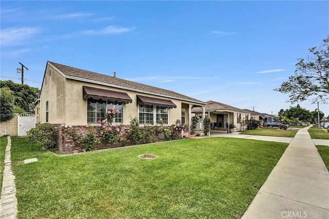 7518 Loch Alene Ave, Pico Rivera, CA 90660 - view of front of property featuring stucco siding, fence, a front yard, and a shingled roof