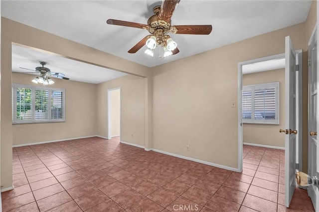 7518 Loch Alene Ave, Pico Rivera, CA 90660 - tiled empty room featuring ceiling fan and baseboards