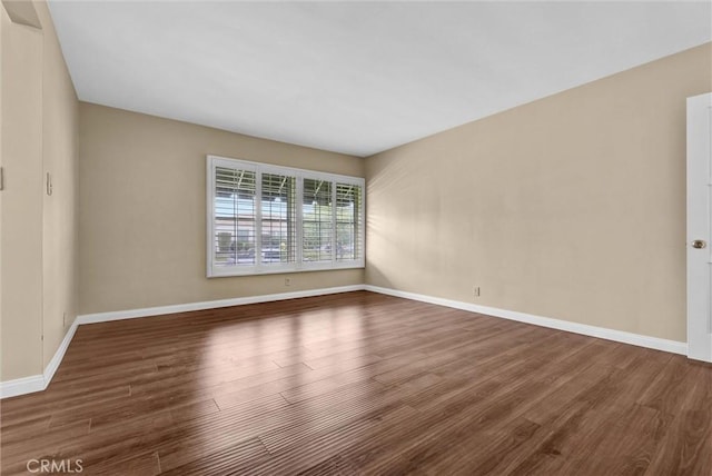 7518 Loch Alene Ave, Pico Rivera, CA 90660 - unfurnished room with wood finished floors and baseboards