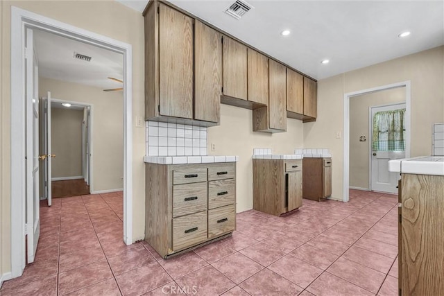 7518 Loch Alene Ave, Pico Rivera, CA 90660 - kitchen with light tile patterned floors, recessed lighting, and visible vents