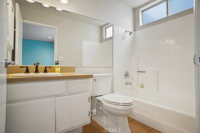 full bathroom with vanity, tile patterned floors, bathtub / shower combination, and toilet
