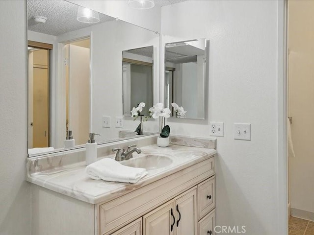 23515 Lyons Ave Unit 286, Valencia, CA 91355 - bathroom with vanity and a textured ceiling