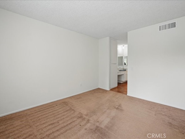 23515 Lyons Ave Unit 286, Valencia, CA 91355 - spare room with carpet and a textured ceiling