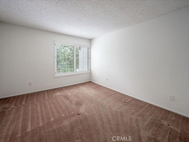 23515 Lyons Ave Unit 286, Valencia, CA 91355 - unfurnished room featuring carpet and a textured ceiling