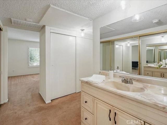 23515 Lyons Ave Unit 286, Valencia, CA 91355 - bathroom with vanity and a textured ceiling