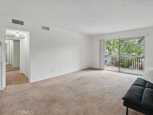 23515 Lyons Ave Unit 286, Valencia, CA 91355 - living area featuring carpet and a textured ceiling