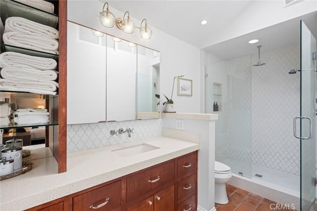 bathroom featuring recessed lighting, a shower stall, tile patterned floors, tasteful backsplash, and toilet