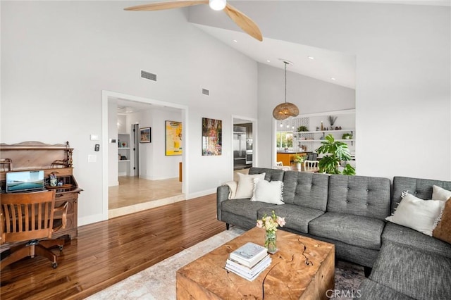 living room featuring recessed lighting, ceiling fan, high vaulted ceiling, visible vents, and wood finished floors