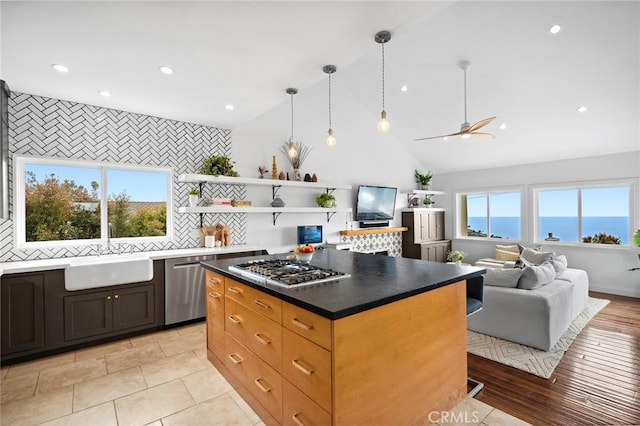 kitchen featuring recessed lighting, a sink, stainless steel appliances, open shelves, and a ceiling fan
