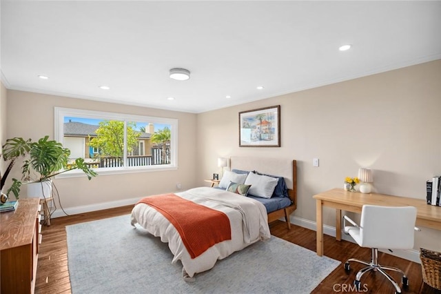 bedroom featuring crown molding, recessed lighting, wood finished floors, and baseboards