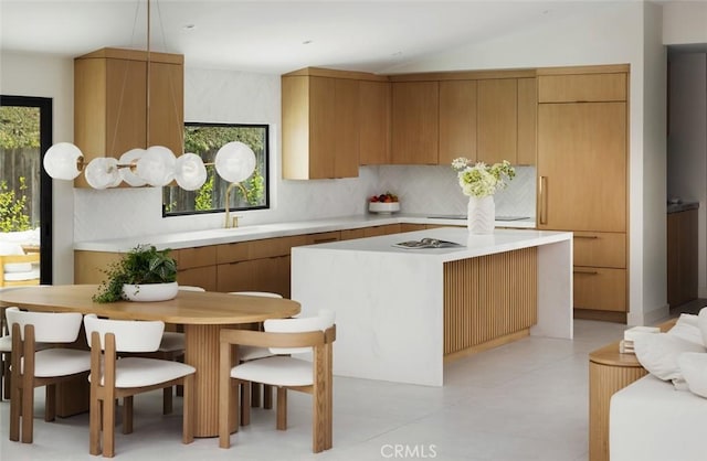 286 Cecil Pl, Costa Mesa, CA 92627 - kitchen featuring a kitchen island, light countertops, backsplash, a sink, and modern cabinets