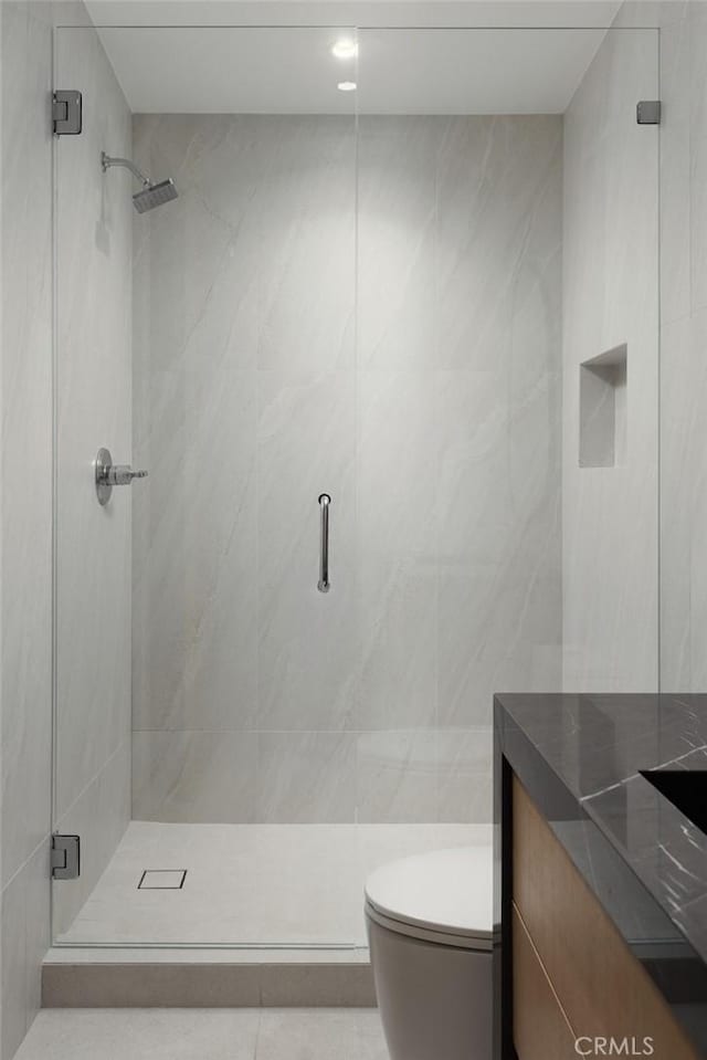 286 Cecil Pl, Costa Mesa, CA 92627 - full bath with tile walls, a shower stall, vanity, toilet, and tile patterned flooring