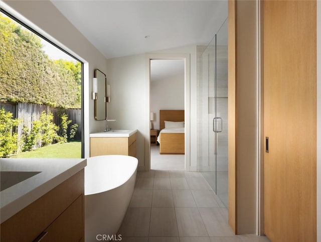 286 Cecil Pl, Costa Mesa, CA 92627 - full bathroom with a shower stall, ensuite bathroom, tile patterned floors, vanity, and a freestanding bath