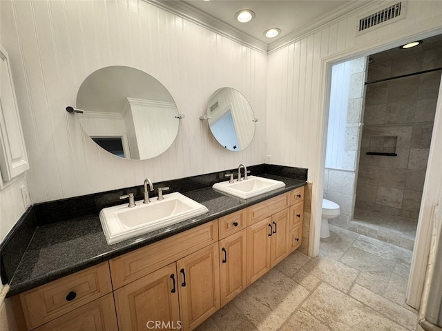 full bathroom featuring double vanity, visible vents, toilet, and a sink