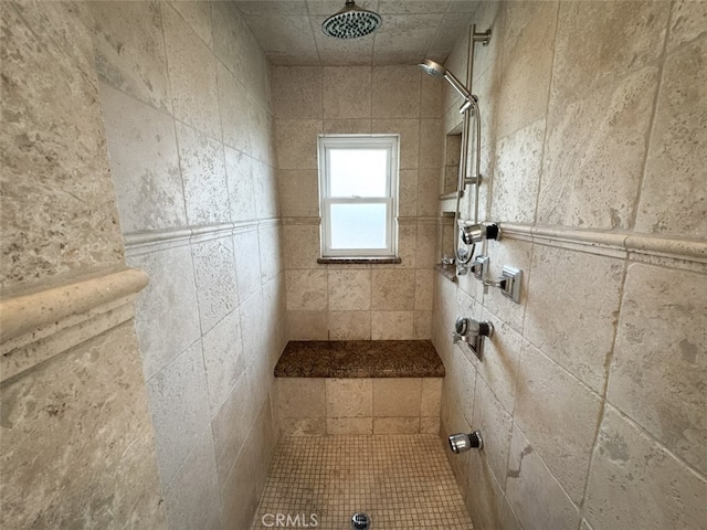 bathroom featuring a tile shower
