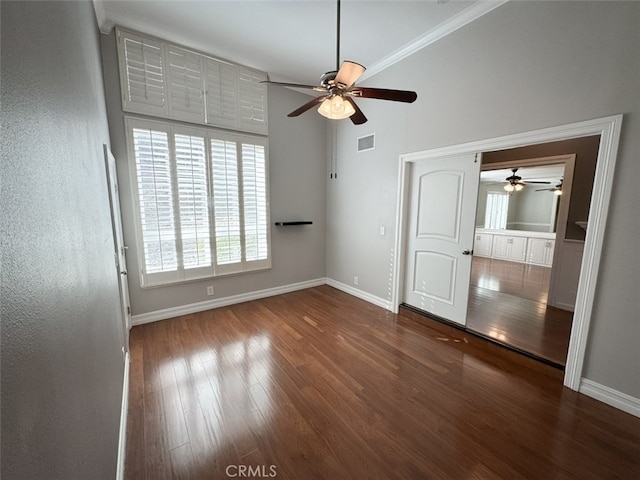unfurnished bedroom with baseboards, visible vents, and wood finished floors