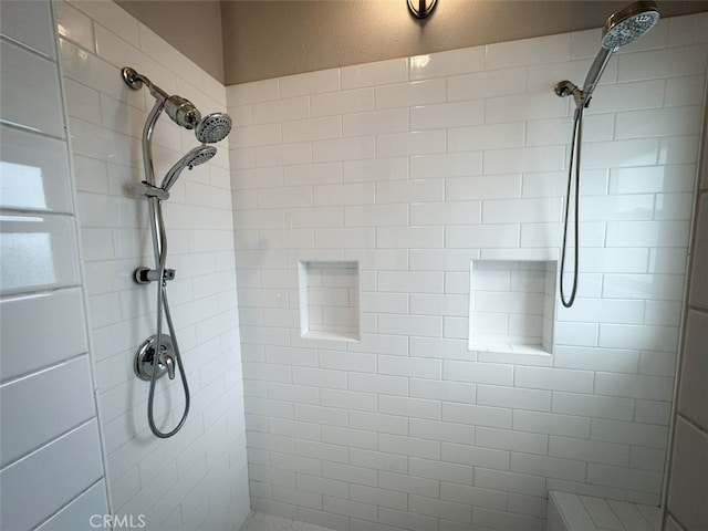 full bath featuring tiled shower