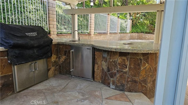 24722 Bracken Ln, Stevenson Ranch, CA 91381 - view of patio with fence, a sink, and an outdoor kitchen