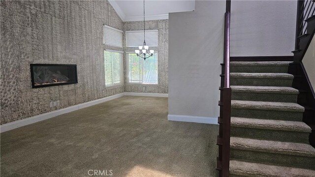 24722 Bracken Ln, Stevenson Ranch, CA 91381 - unfurnished living room featuring stairway, baseboards, a chandelier, carpet flooring, and wallpapered walls