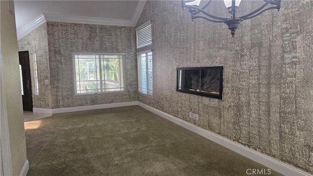 24722 Bracken Ln, Stevenson Ranch, CA 91381 - unfurnished living room with crown molding, carpet flooring, baseboards, and a glass covered fireplace