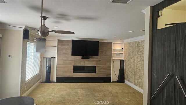 24722 Bracken Ln, Stevenson Ranch, CA 91381 - unfurnished living room with crown molding, baseboards, ceiling fan, a tile fireplace, and carpet