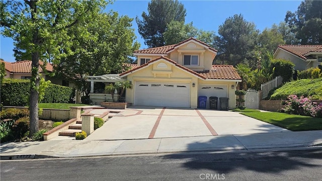 24722 Bracken Ln, Stevenson Ranch, CA 91381 - mediterranean / spanish home with driveway, a tile roof, fence, an attached garage, and stucco siding