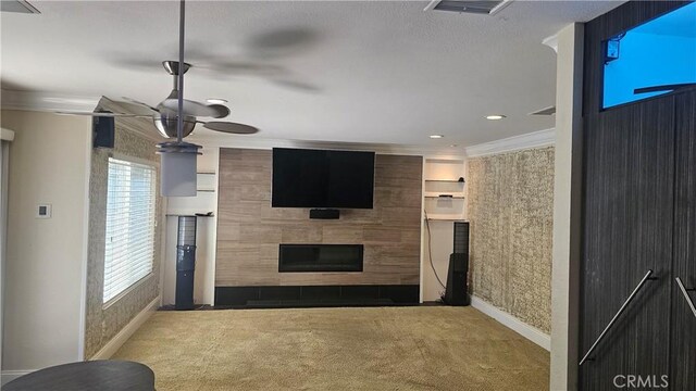 24722 Bracken Ln, Stevenson Ranch, CA 91381 - unfurnished living room with visible vents, crown molding, a tiled fireplace, carpet floors, and baseboards