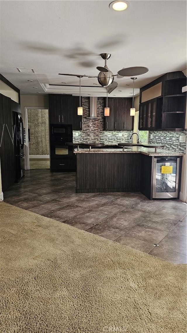 24722 Bracken Ln, Stevenson Ranch, CA 91381 - kitchen featuring a ceiling fan, wine cooler, wall chimney range hood, and tasteful backsplash
