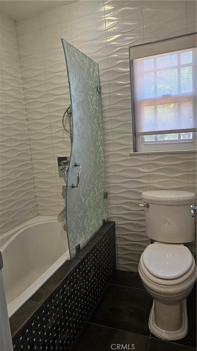 24722 Bracken Ln, Stevenson Ranch, CA 91381 - full bathroom featuring a bathtub, tile walls, tile patterned flooring, a shower, and toilet