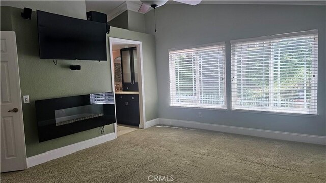 24722 Bracken Ln, Stevenson Ranch, CA 91381 - unfurnished living room with a ceiling fan, baseboards, and light colored carpet