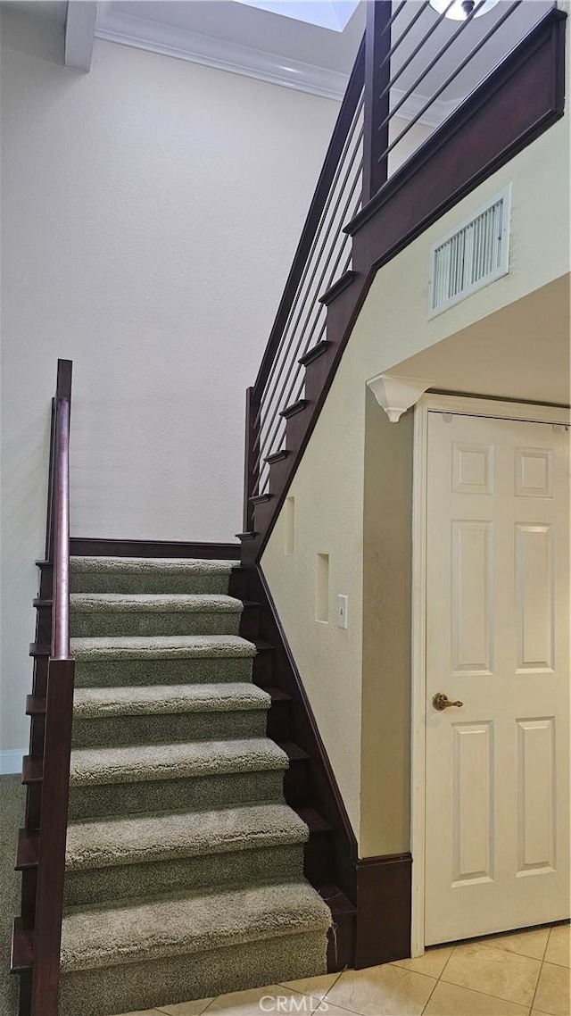 24722 Bracken Ln, Stevenson Ranch, CA 91381 - staircase with tile patterned flooring and ornamental molding