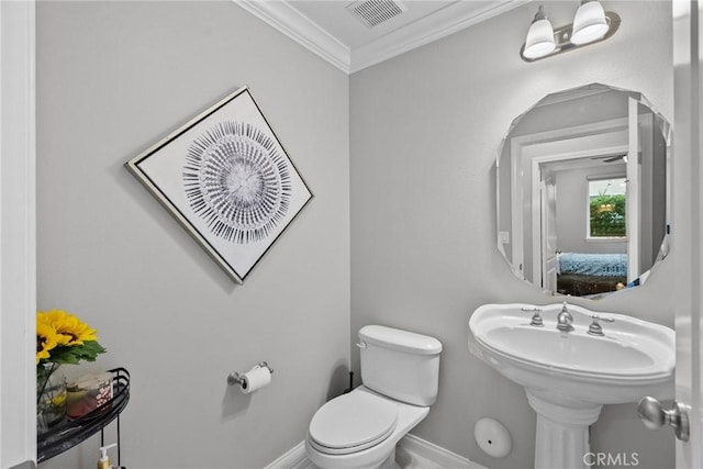 20704 Campania Ln, Porter Ranch, CA 91326 - half bathroom featuring connected bathroom, crown molding, toilet, visible vents, and baseboards