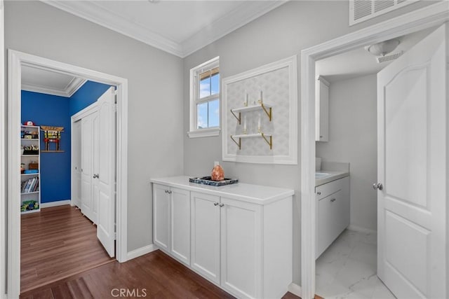 20704 Campania Ln, Porter Ranch, CA 91326 - hallway with ornamental molding, visible vents, dark wood-style flooring, and baseboards