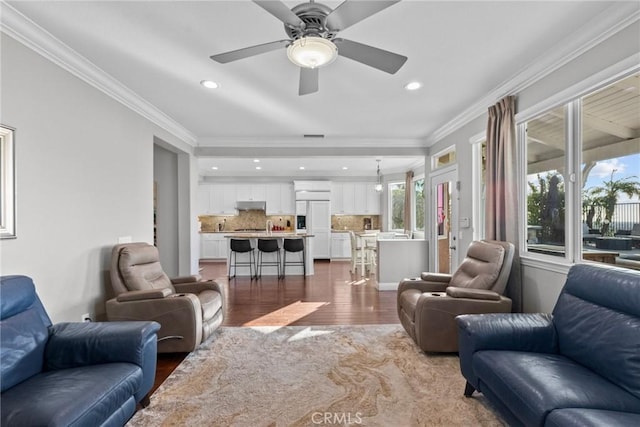 20704 Campania Ln, Porter Ranch, CA 91326 - living area with recessed lighting, ornamental molding, ceiling fan, and dark wood-style flooring