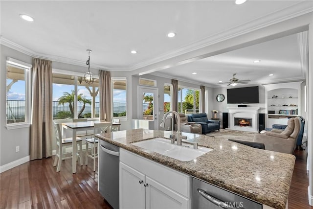 20704 Campania Ln, Porter Ranch, CA 91326 - kitchen featuring stainless steel dishwasher, a kitchen island with sink, ceiling fan, a sink, and dark wood-style floors