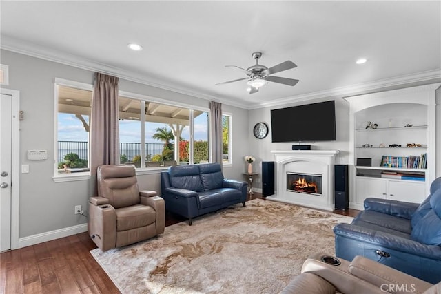 20704 Campania Ln, Porter Ranch, CA 91326 - living area featuring ceiling fan, hardwood / wood-style floors, baseboards, a glass covered fireplace, and ornamental molding
