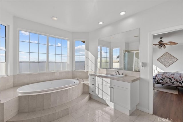 20704 Campania Ln, Porter Ranch, CA 91326 - full bath with a stall shower, recessed lighting, tile patterned floors, a garden tub, and vanity