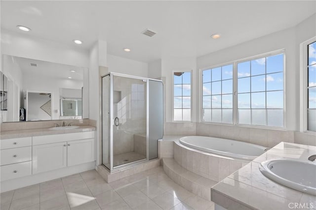 20704 Campania Ln, Porter Ranch, CA 91326 - bathroom featuring a wealth of natural light, a garden tub, and a shower stall