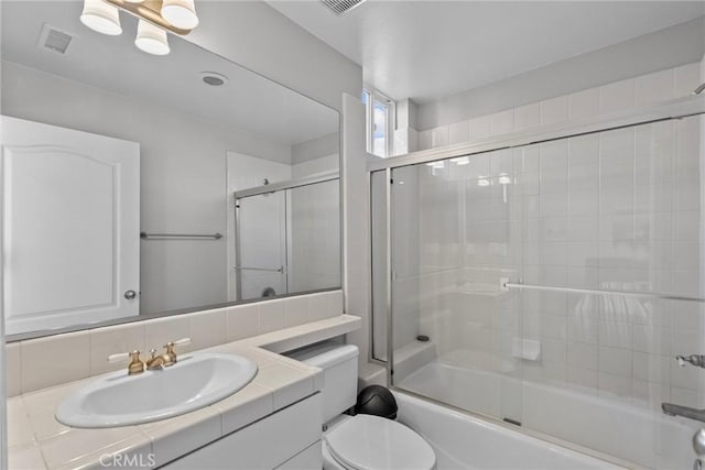 20704 Campania Ln, Porter Ranch, CA 91326 - full bath with toilet, combined bath / shower with glass door, visible vents, and vanity