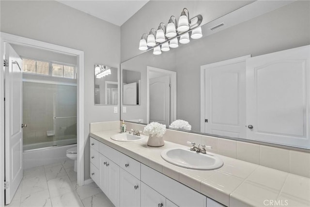 20704 Campania Ln, Porter Ranch, CA 91326 - bathroom with toilet, marble finish floor, a sink, and double vanity