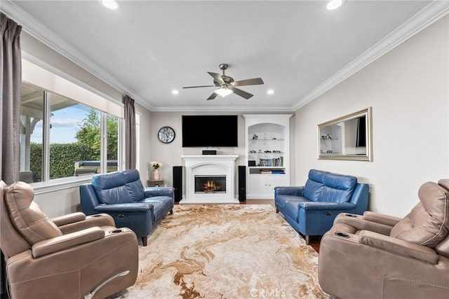 20704 Campania Ln, Porter Ranch, CA 91326 - living area with recessed lighting, built in features, a glass covered fireplace, a ceiling fan, and crown molding
