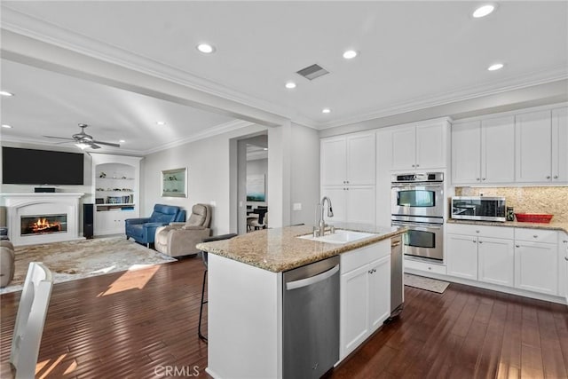 20704 Campania Ln, Porter Ranch, CA 91326 - kitchen featuring light stone countertops, a sink, dark wood-style flooring, and stainless steel appliances
