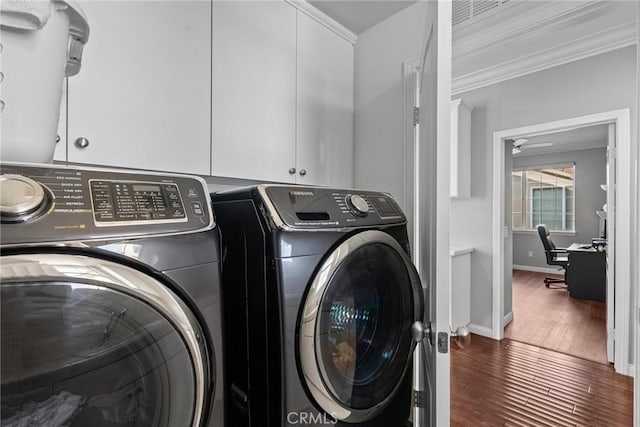 20704 Campania Ln, Porter Ranch, CA 91326 - washroom featuring crown molding, washing machine and dryer, baseboards, cabinet space, and wood finished floors