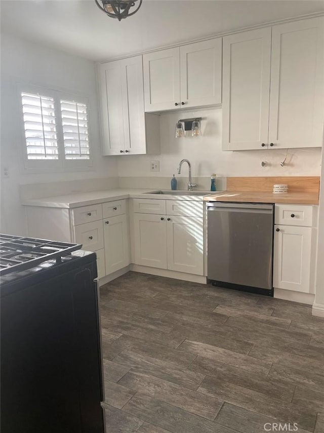 2109 Warfield Ave, Redondo Beach, CA 90278 - kitchen featuring stainless steel dishwasher, white cabinetry, a sink, and black gas range