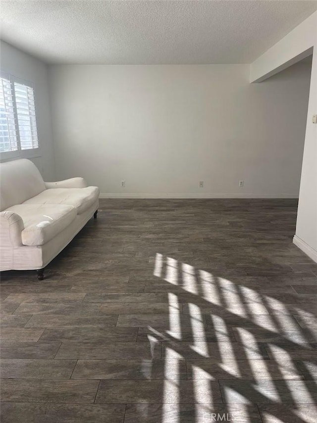 2109 Warfield Ave, Redondo Beach, CA 90278 - living area with dark wood-style flooring, a textured ceiling, and baseboards