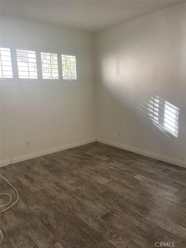 2109 Warfield Ave, Redondo Beach, CA 90278 - unfurnished room with baseboards and dark wood-style flooring